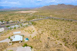 Fountain Hills, Arizona, showing Sonoran Desert terrain with scattered residential properties with sparse vegetation and developed areas. Fountain Hills, Arizona, showing Sonoran Desert terrain with scattered residential properties with sparse vegetation and developed areas.