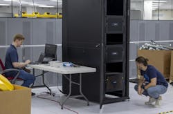 The diamond-based quantum processor units used by Quantum Brilliance operate at room temperature in a relatively small package. Quantum Brilliance engineers (from left) Lachlan Whichello and Reuben Singer fine-tune the system installed in a data center at ORNL's National Center for Computational Sciences. The diamond-based quantum processor units used by Quantum Brilliance operate at room temperature in a relatively small package. Quantum Brilliance engineers (from left) Lachlan Whichello and Reuben Singer fine-tune the system installed in a data center at ORNL's National Center for Computational Sciences.