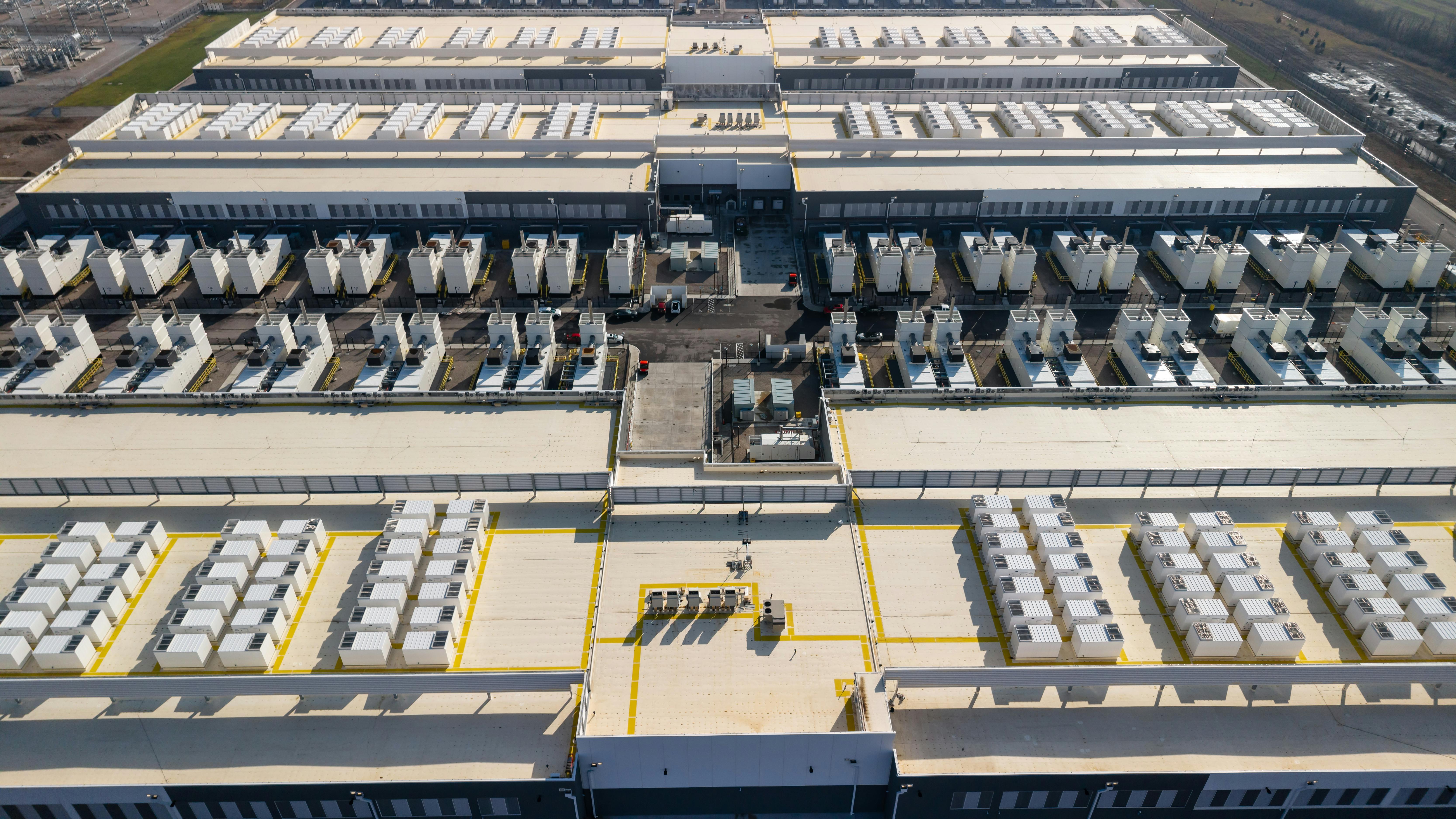 Aerial view of a large data center campus in Ohio with extensive rooftop cooling units.