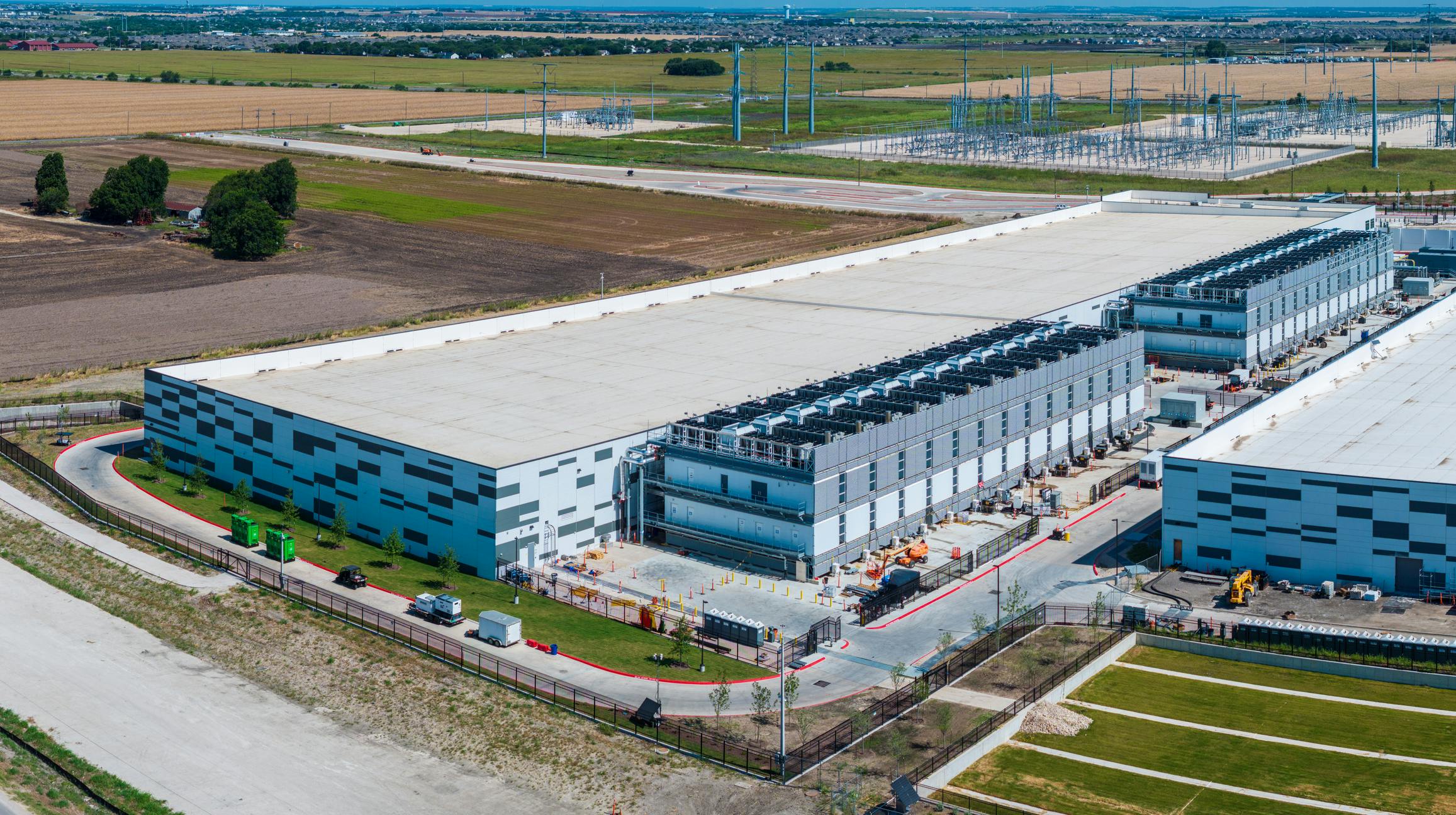 Skybox Datacenters&rsquo; PowerCampus Austin in Hutto, Texas, is a 160-acre hyperscale campus designed for up to 600 MW of power capacity and as much as 4 million square feet of data center space. The development is supported by an onsite privately owned substation in Oncor territory, underscoring the scale of the infrastructure buildout continuing in Texas as the state tightens scrutiny of grid access, infrastructure costs and resource use. (Photo: BackYard Production)