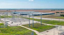Electrical power grid substation feeding 600 MW to new AI data center campus construction in Hutto, Texas.