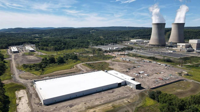 Amazon Web Services&rsquo; data center campus sits adjacent to Talen Energy&rsquo;s Susquehanna nuclear power plant in Salem Township, Pennsylvania, where co-located generation has become a test case for how large data center loads should interact with the regional grid.