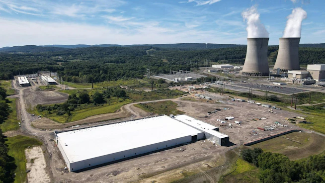 Amazon Web Services&rsquo; data center campus sits adjacent to Talen Energy&rsquo;s Susquehanna nuclear power plant in Salem Township, Pennsylvania, where co-located generation has become a test case for how large data center loads should interact with the regional grid.