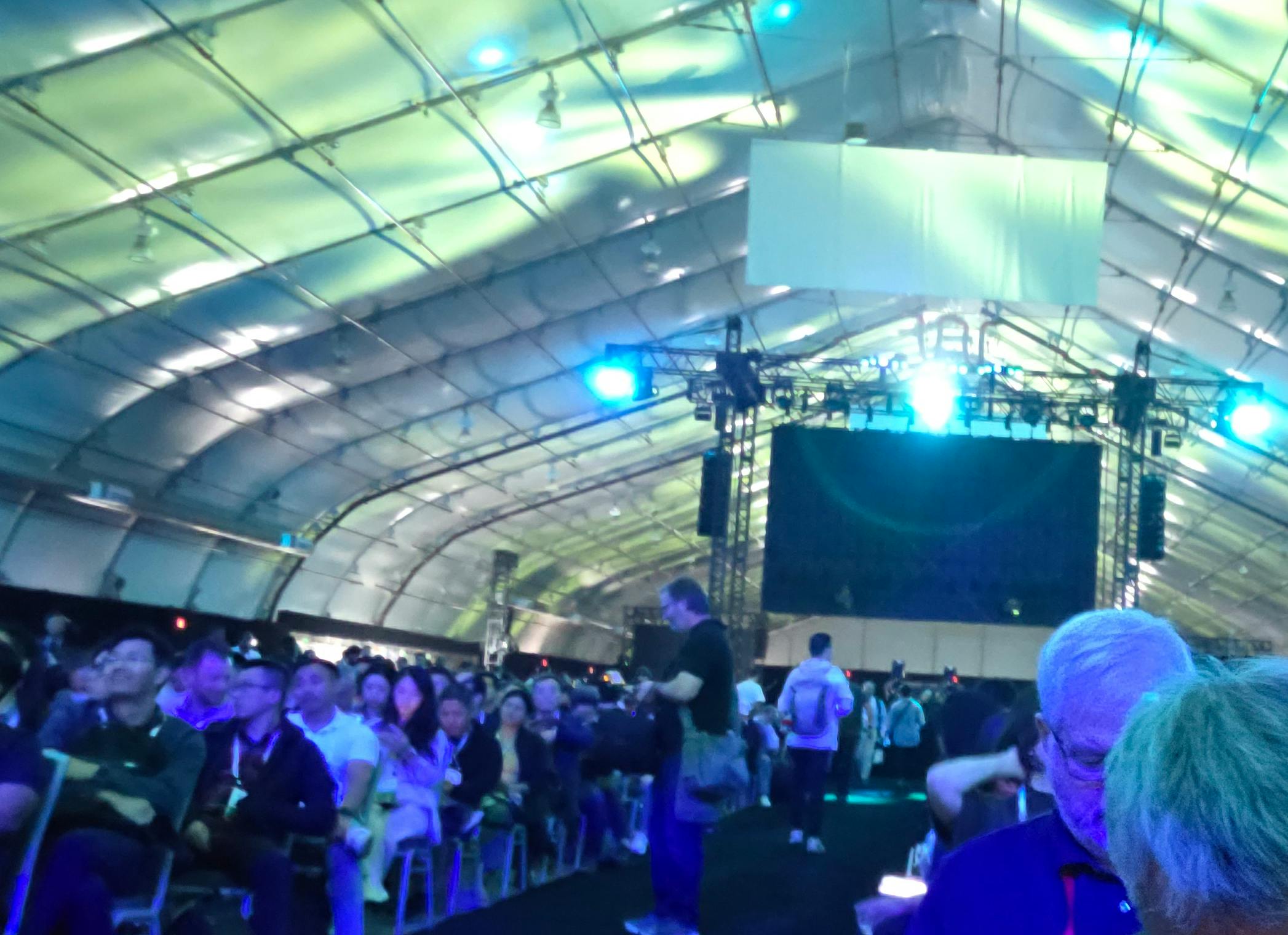 The fabric-roofed keynote hall at OCP 2026 in San Jose was built by Sprung Structures, the same company supplying massive engineered enclosures for Meta&rsquo;s Prometheus AI campus in Ohio. Meta&rsquo;s Santosh Janardhan noted that the approach can help bring data center capacity online in just three to five months, versus years for conventional construction.
