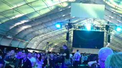 The fabric-roofed keynote hall at OCP 2026 in San Jose was built by Sprung Structures, the same company supplying massive engineered enclosures for Meta’s Prometheus AI campus in Ohio. Meta’s Santosh Janardhan noted that the approach can help bring data center capacity online in just three to five months, versus years for conventional construction.